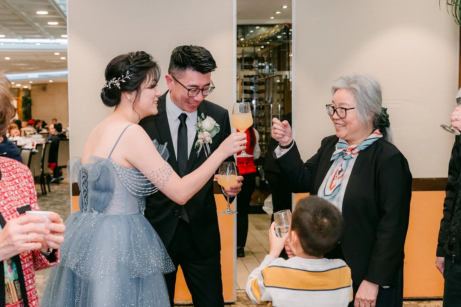 Eunice and Eric raise their glasses with a guest