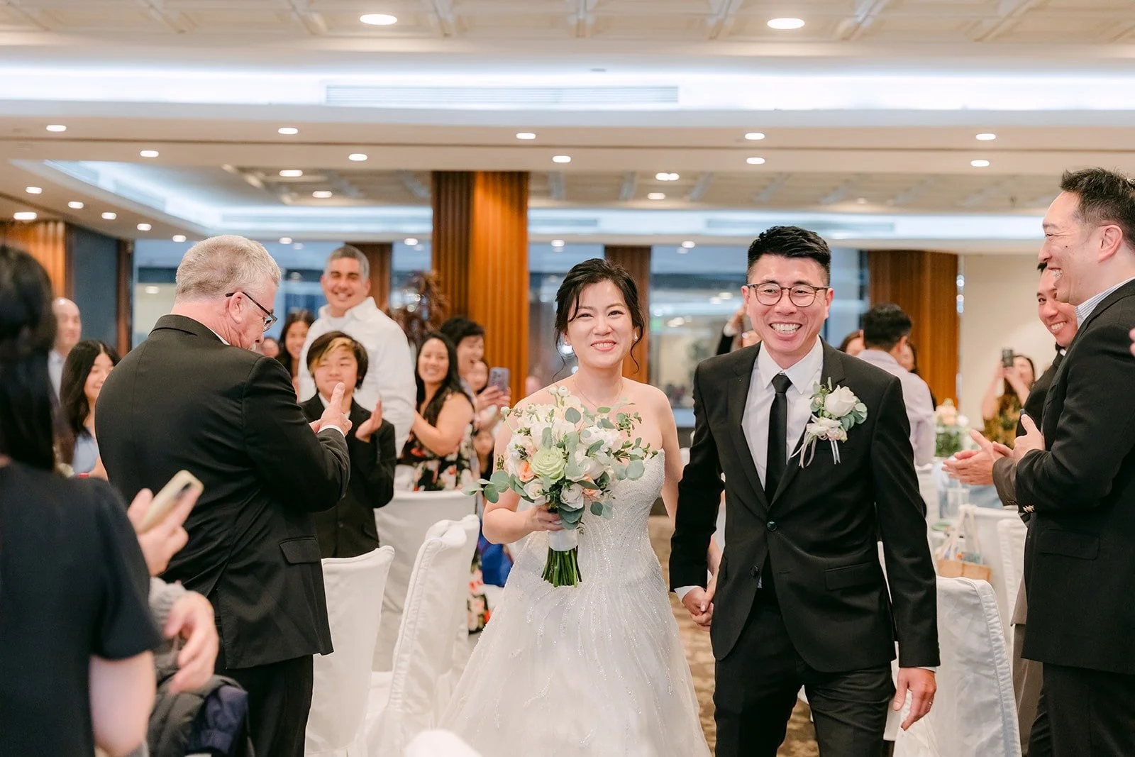 Eunice and Eric make their grand entrance as Mr. and Mrs. Jong