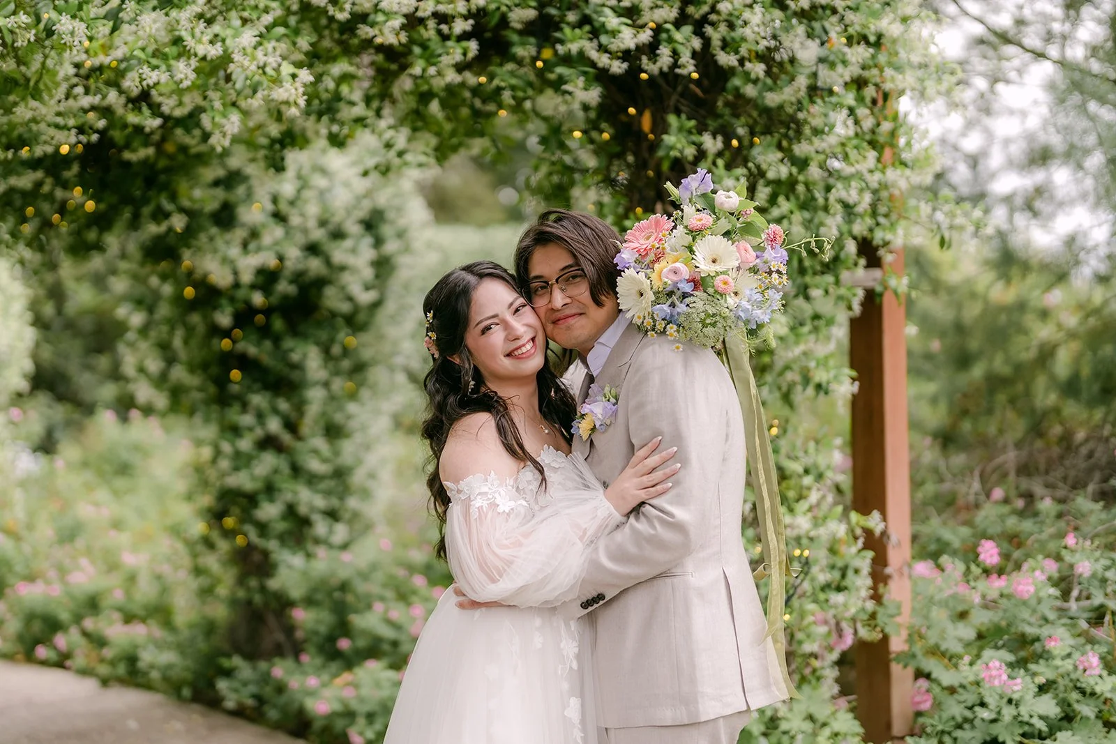Kat laughing with Mike beneath the ivy archway