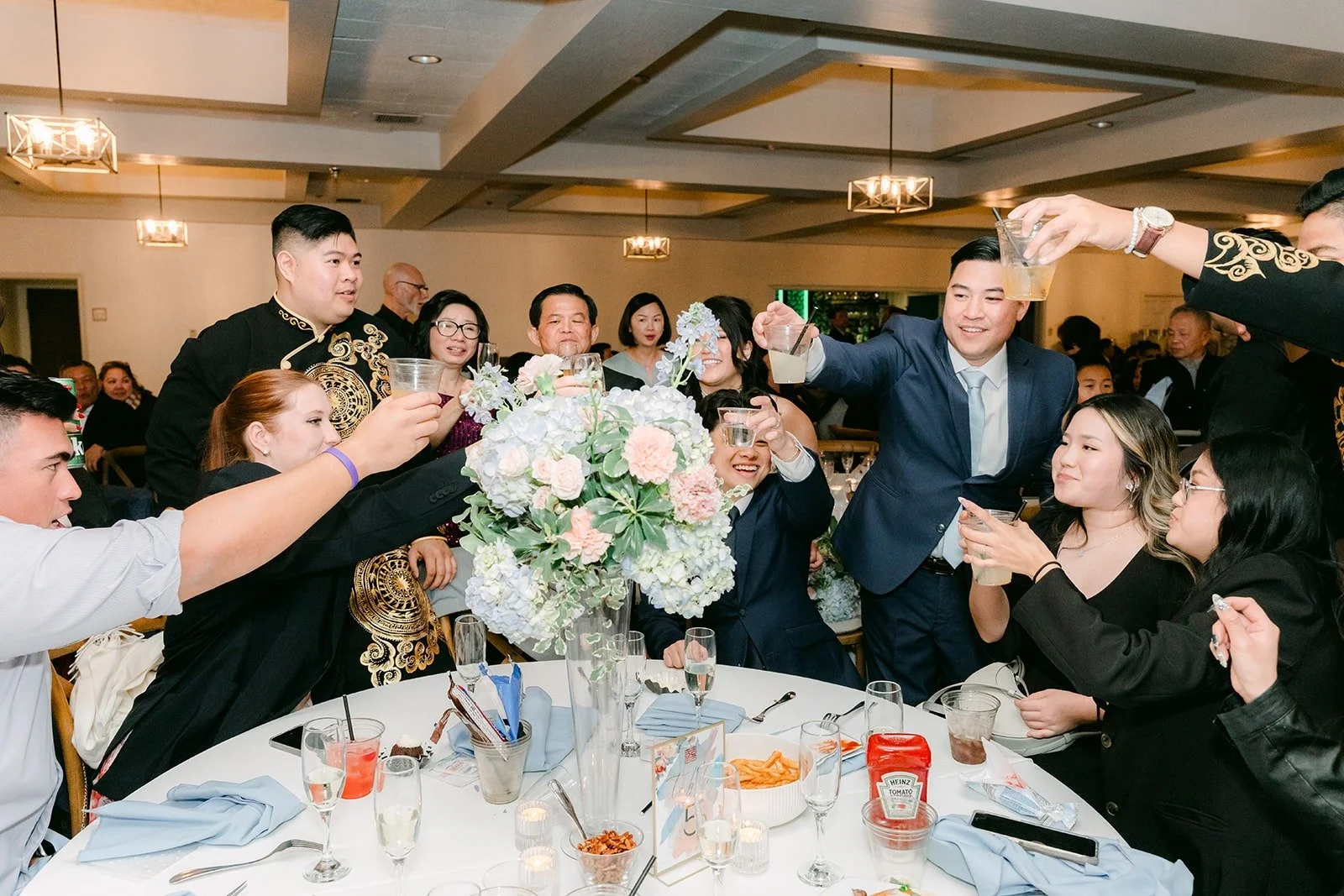 Guests toasting at their tables in the Mediterranean Ballroom