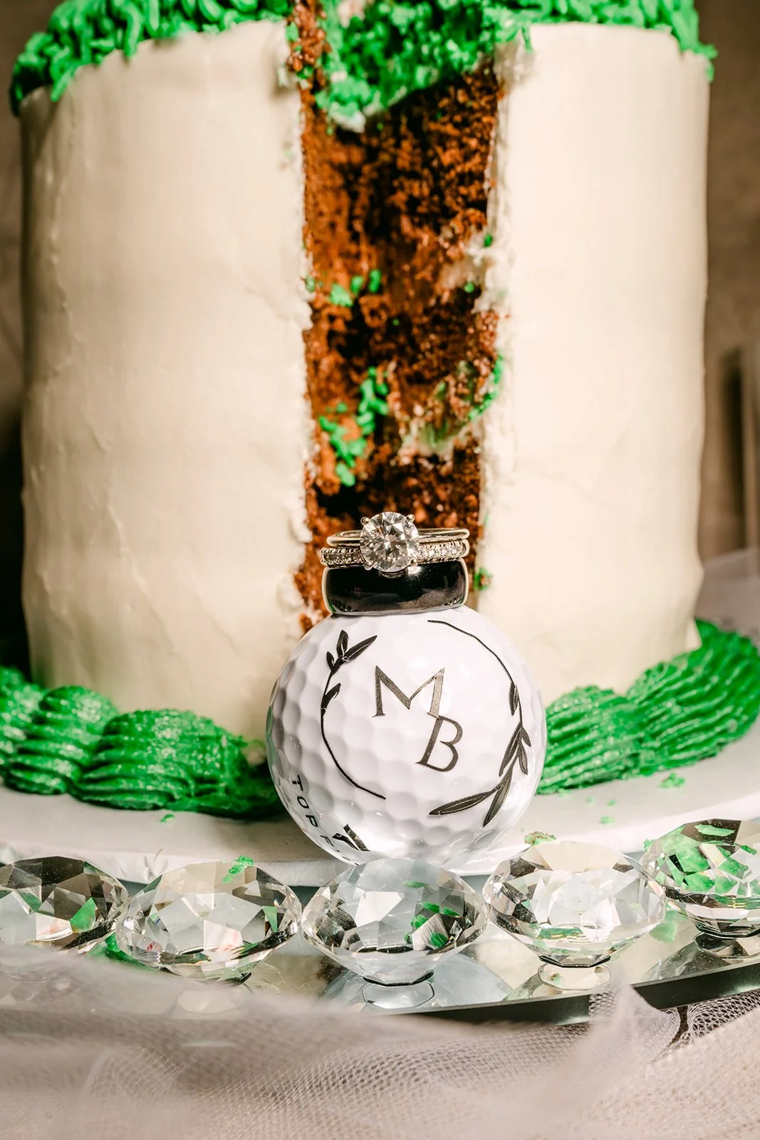 MB monogram ornament in front of a green and white cake.