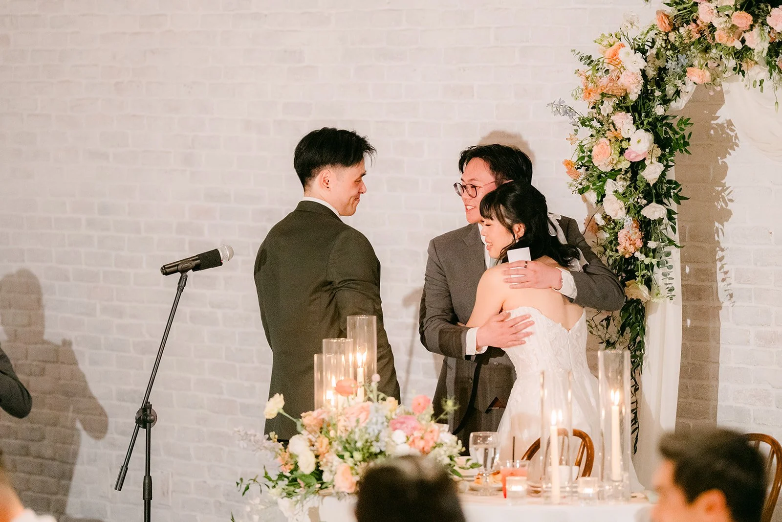 Vivian and Alex hugging after a speech