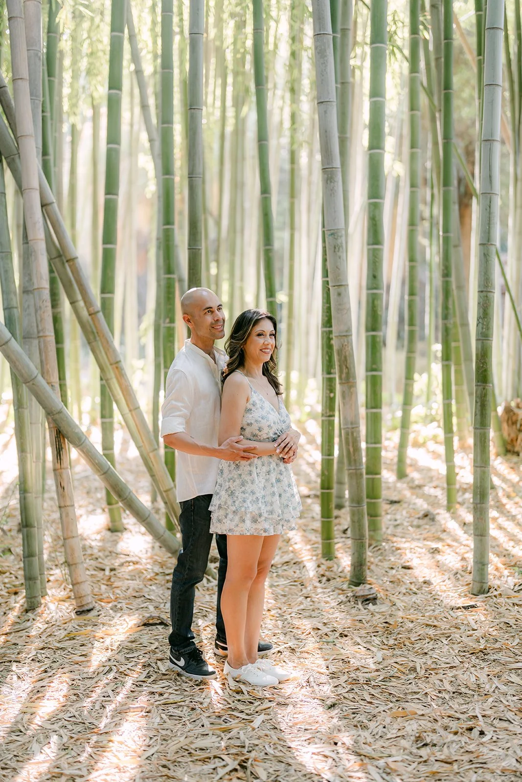 Francesca and Daniel stand together in the bamboo forest at the LA Arboretum.