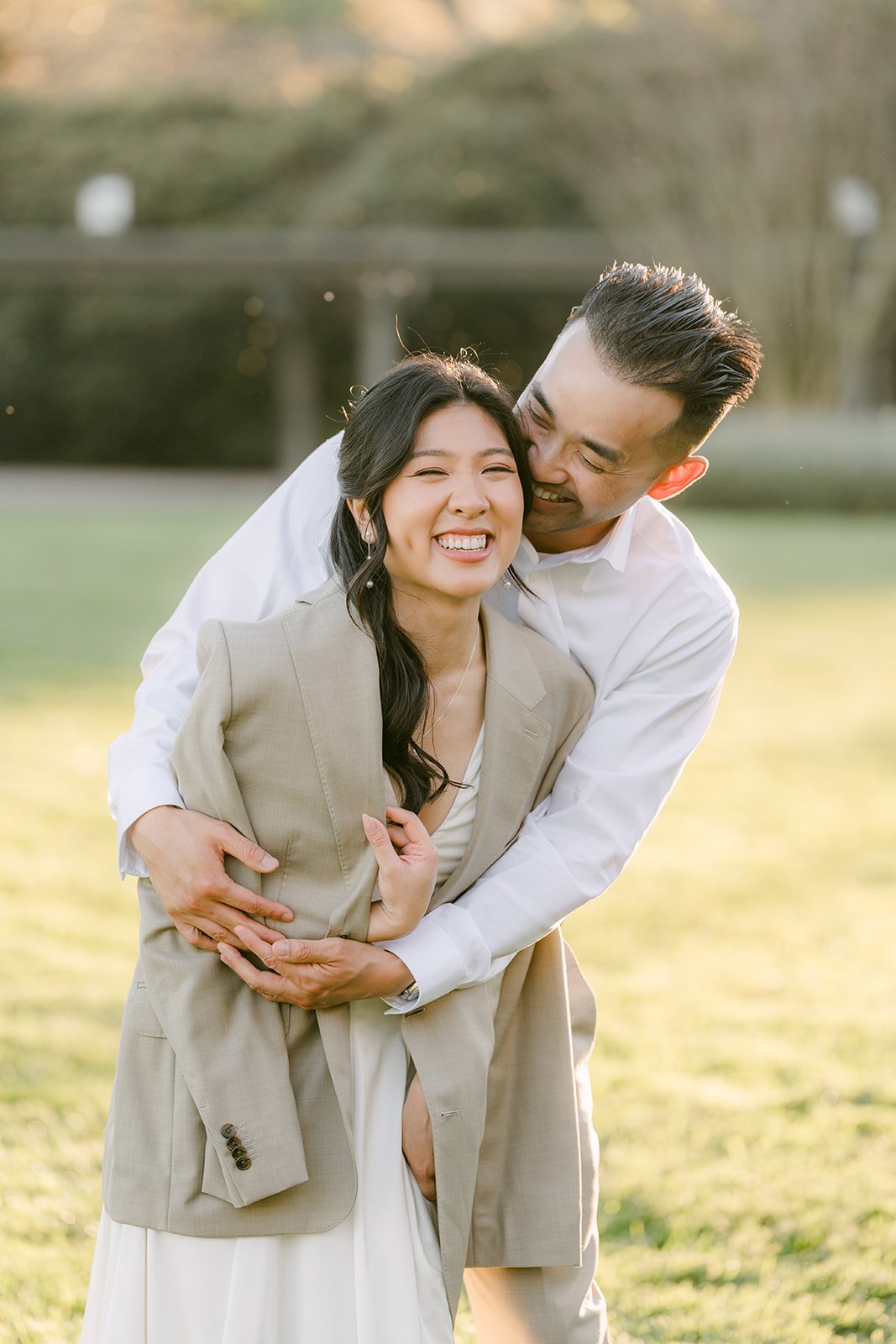Vincent wraps Kim in a hug in the evening light.