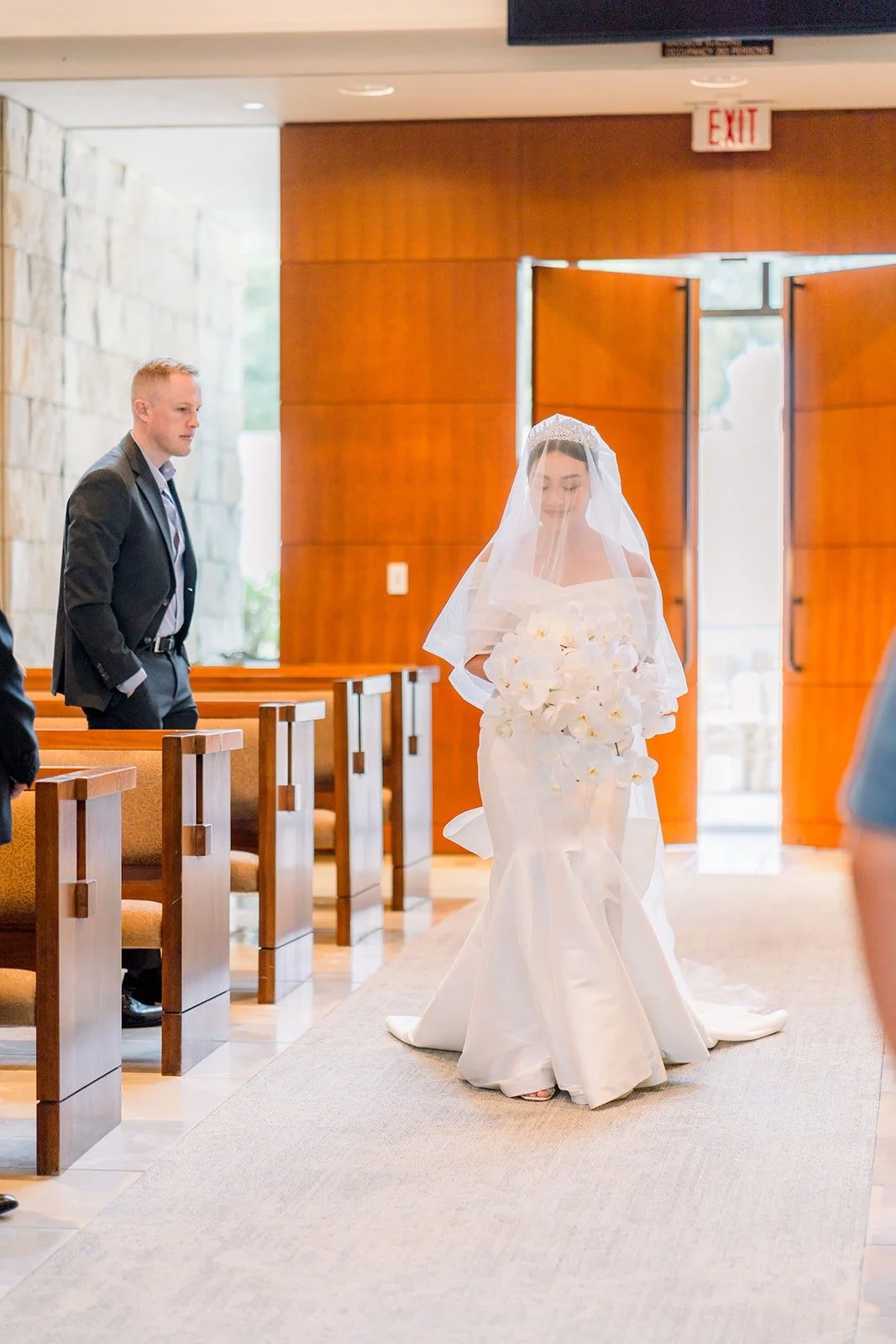 Jacinda in her veil at the head of the aisle