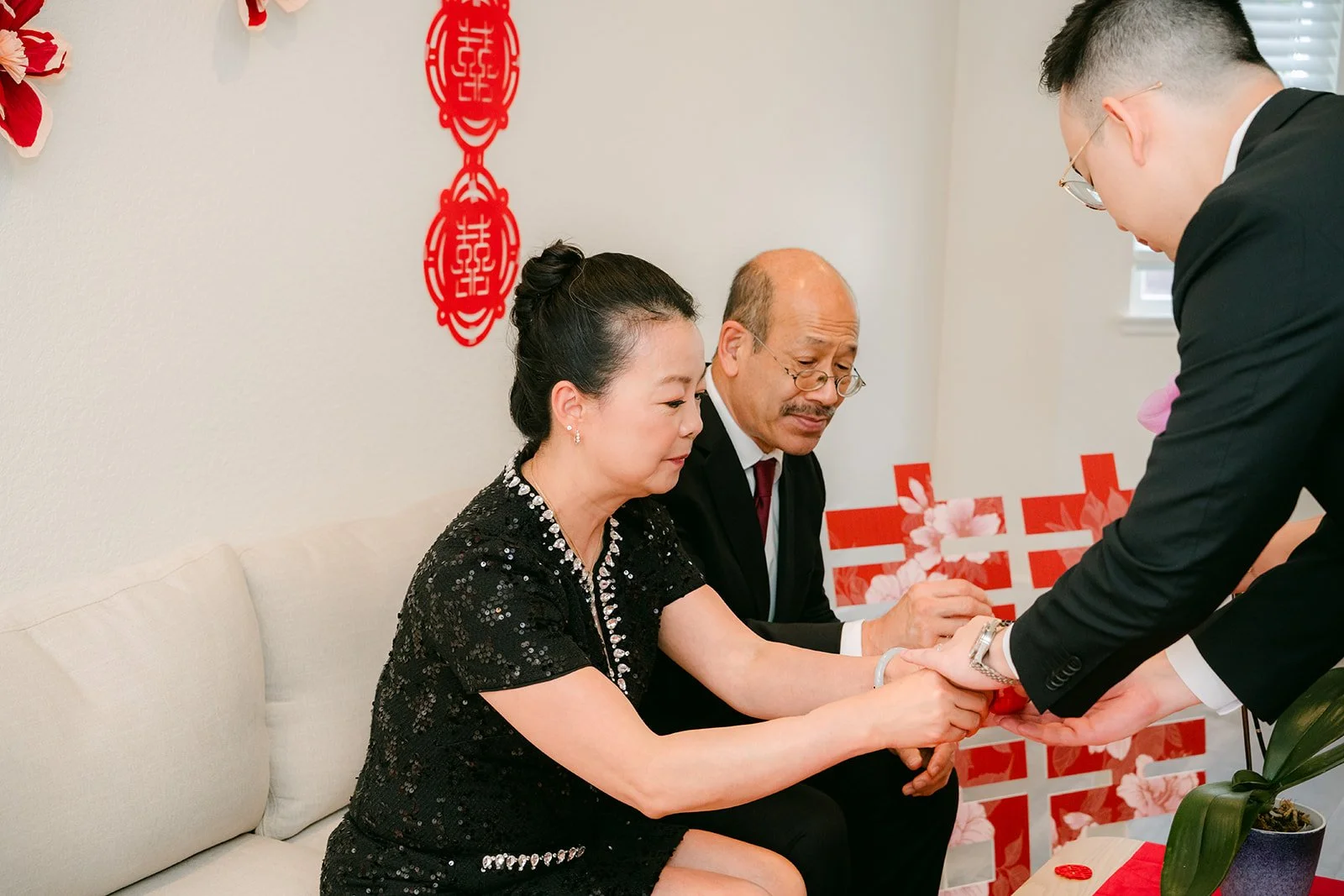 Pauline and Ken serving tea to Ken's parents.