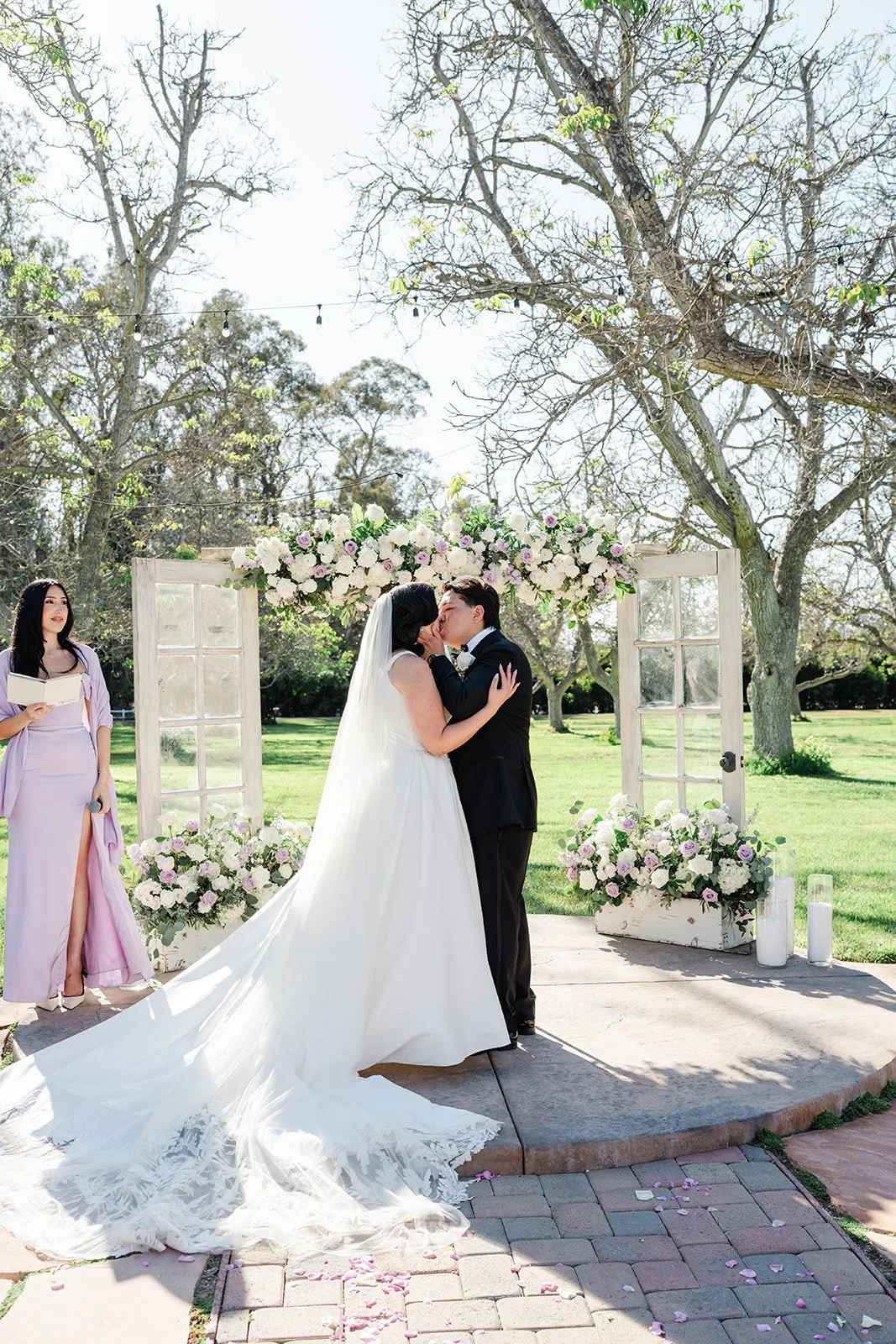 First kiss under the floral arch at The Walnut Grove