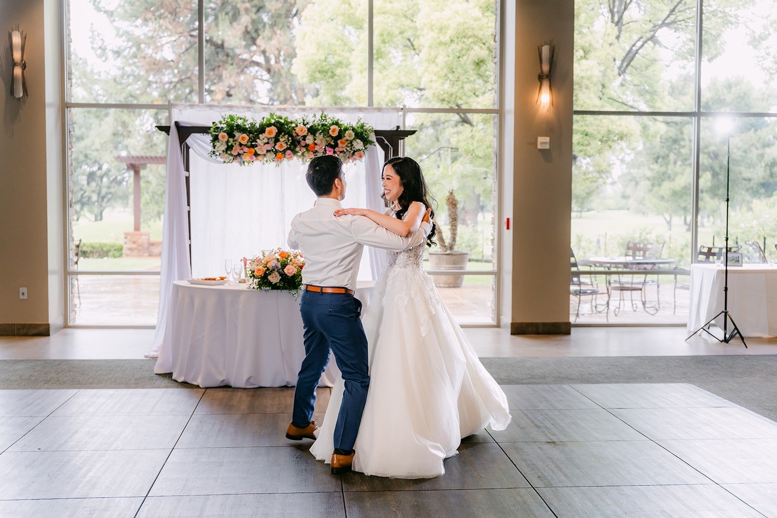 Natalie and Mark's first dance in front of the sweetheart table