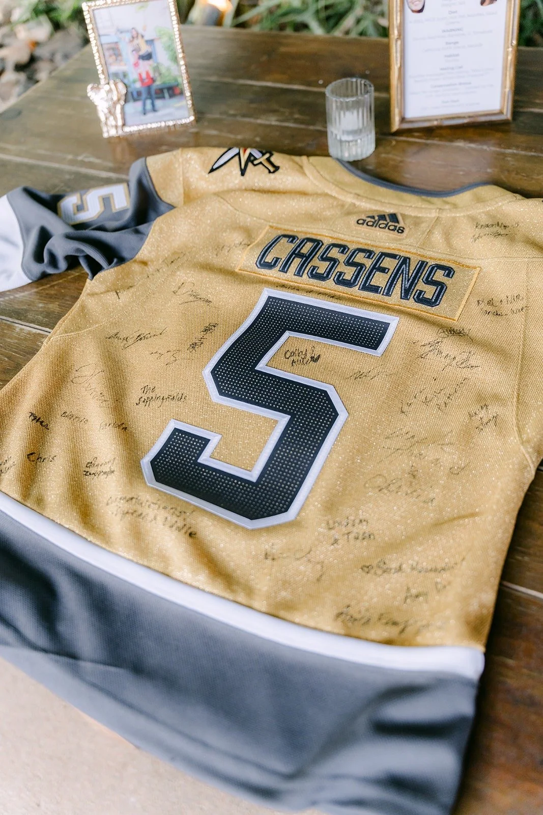 A gold Cassens number 5 jersey signed by guests as the guestbook