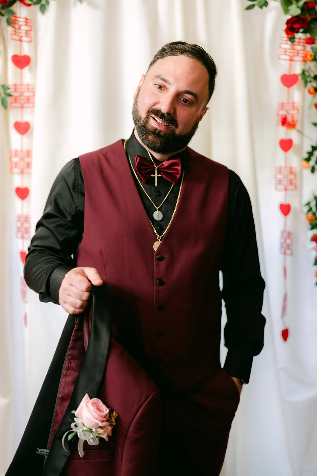Ryan with his jacket over his shoulder, photographed by One and Only Production.