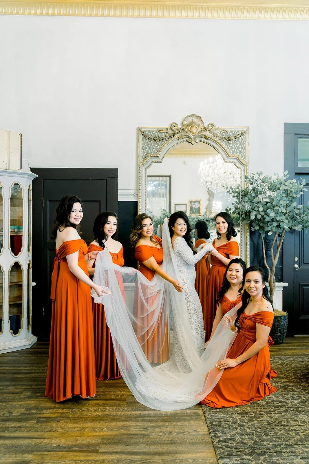 Bridesmaids arranging Hannah's veil