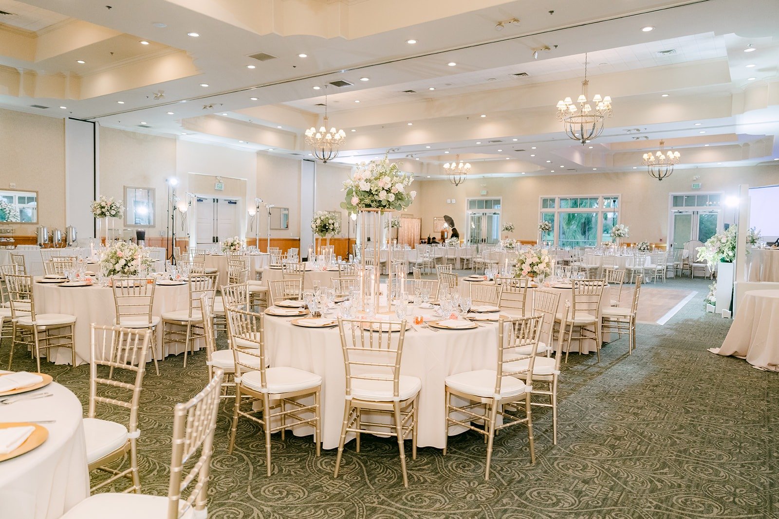 Reception tables and chiavari chairs in the ballroom
