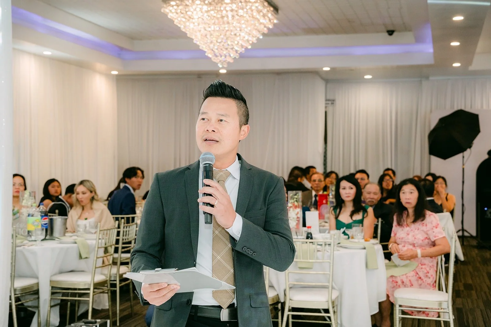 The emcee introduces the wedding party at Diamond Seafood Palace 3
