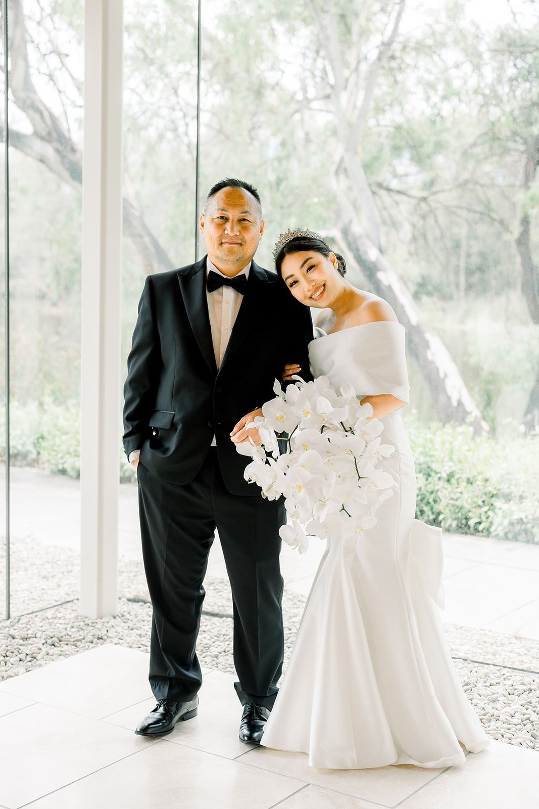Steven and Jacinda together in the glass hall, photographed by One and Only Production