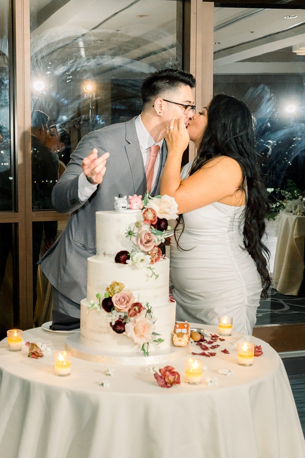 Mikey and Betsy feed each other cake