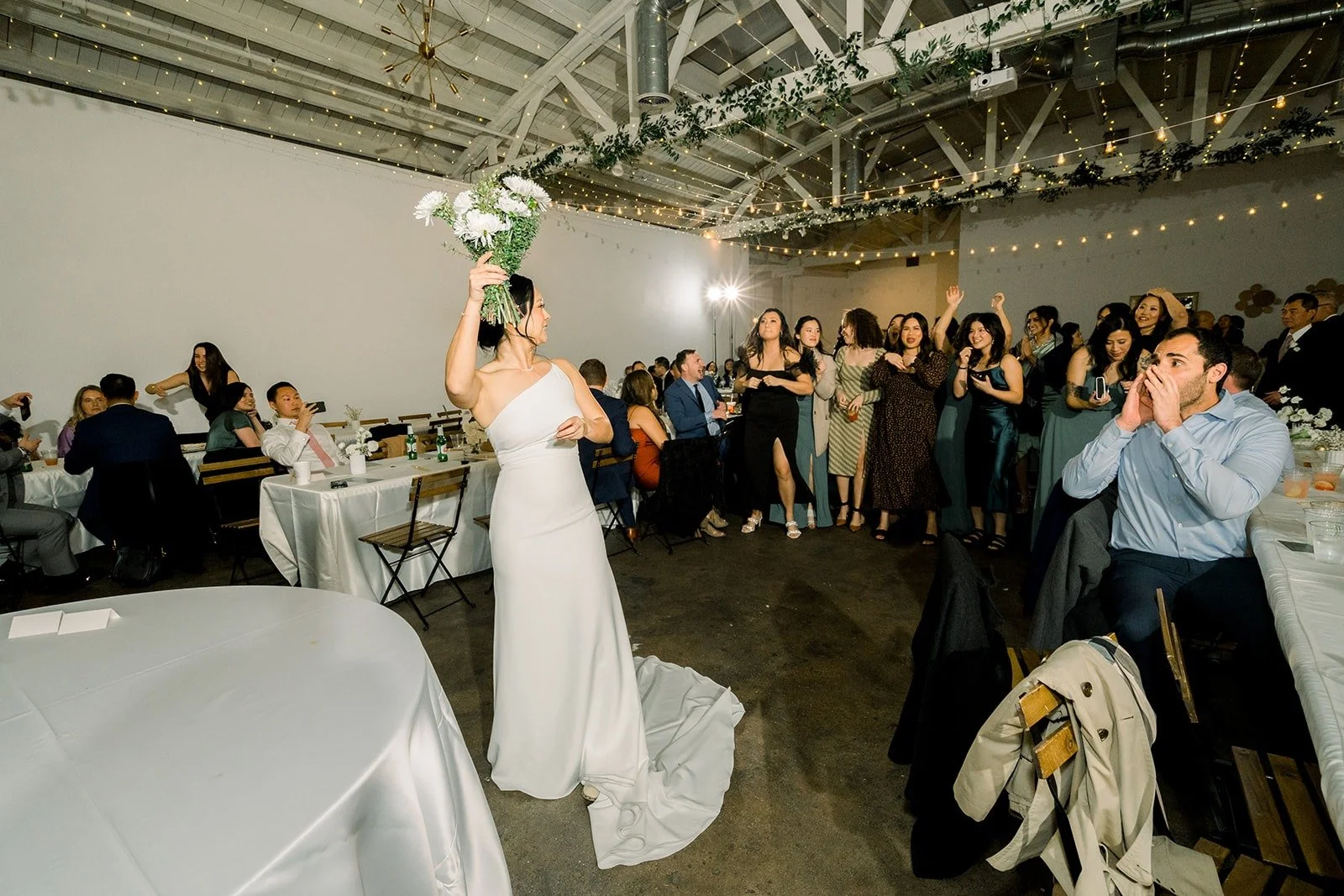Cindy gets ready to toss her bouquet