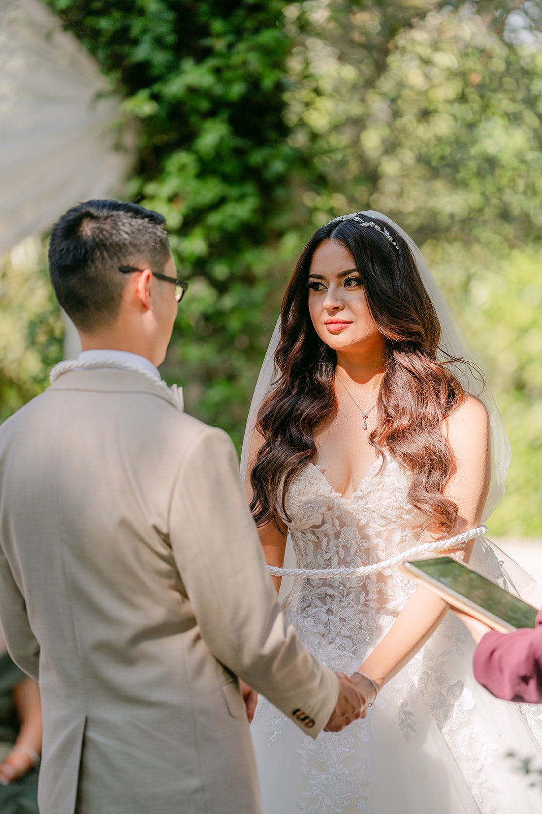 Kevin holding Sandra's hands during their ceremony.