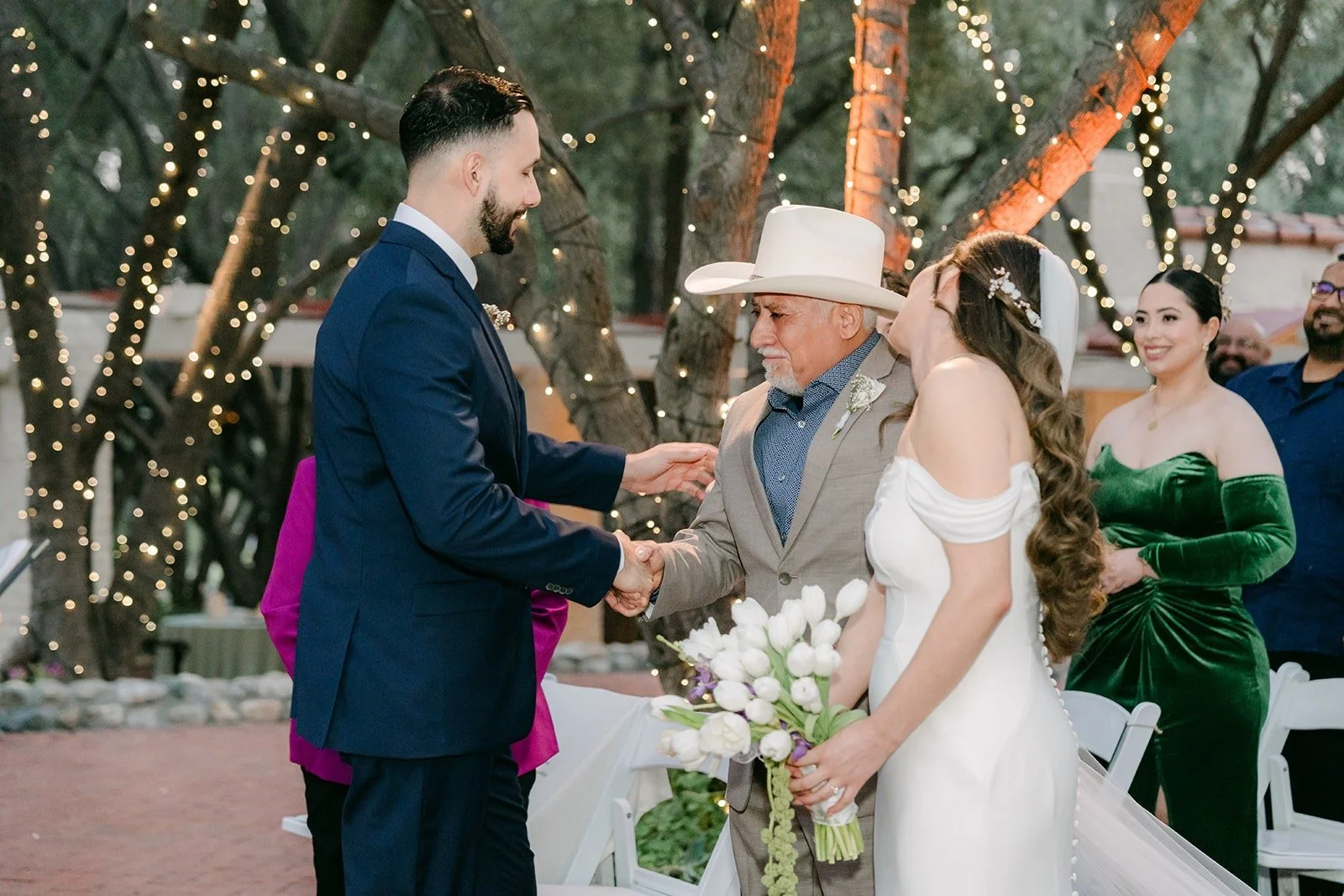 Danny greeting Mariana at the front of the aisle