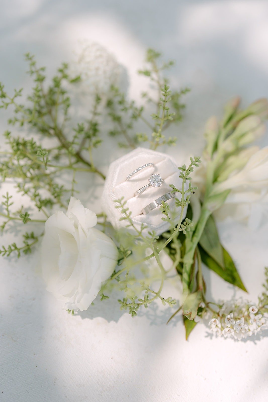 White roses and greenery from Amy's flat lay