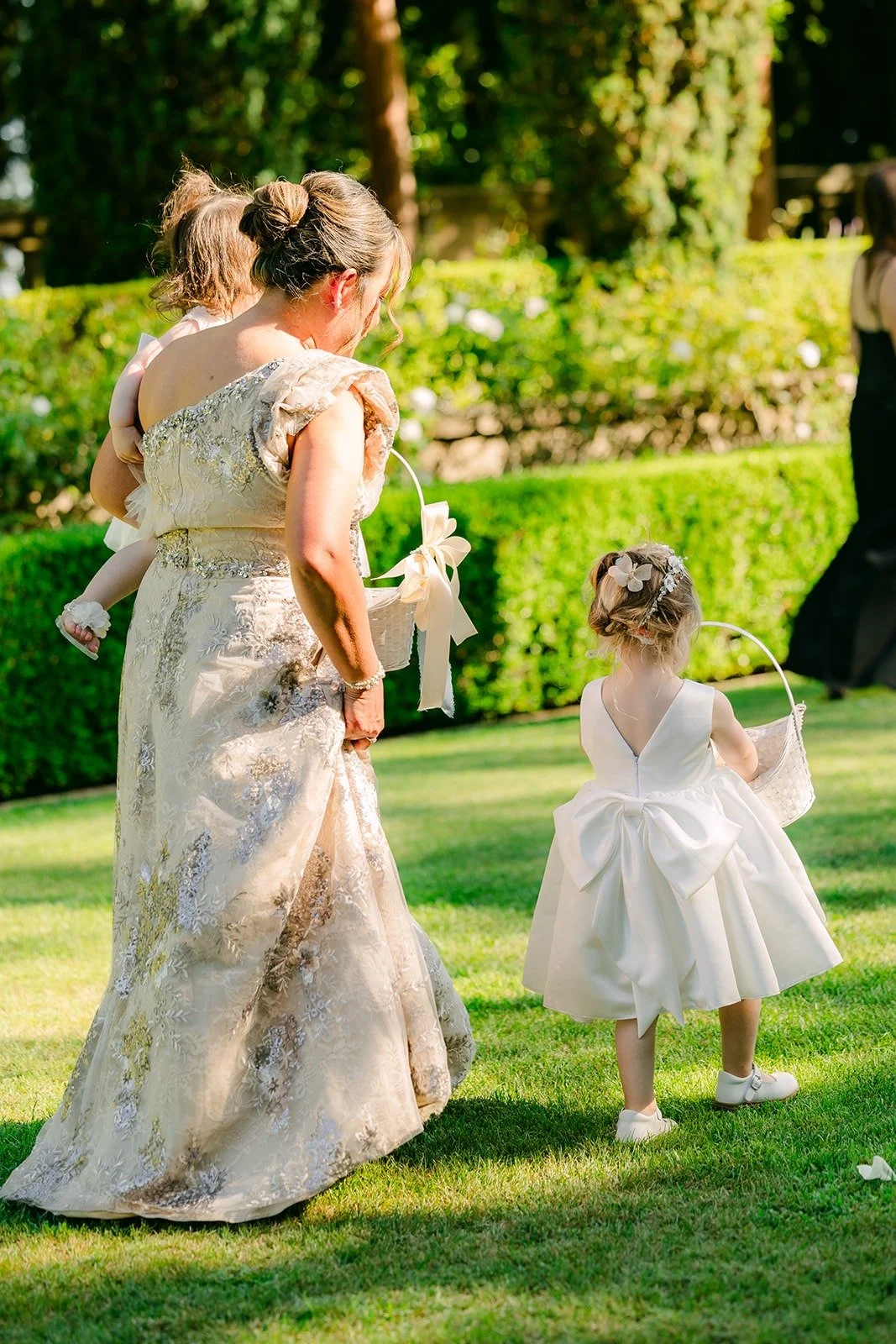 The flower girl walking down the aisle