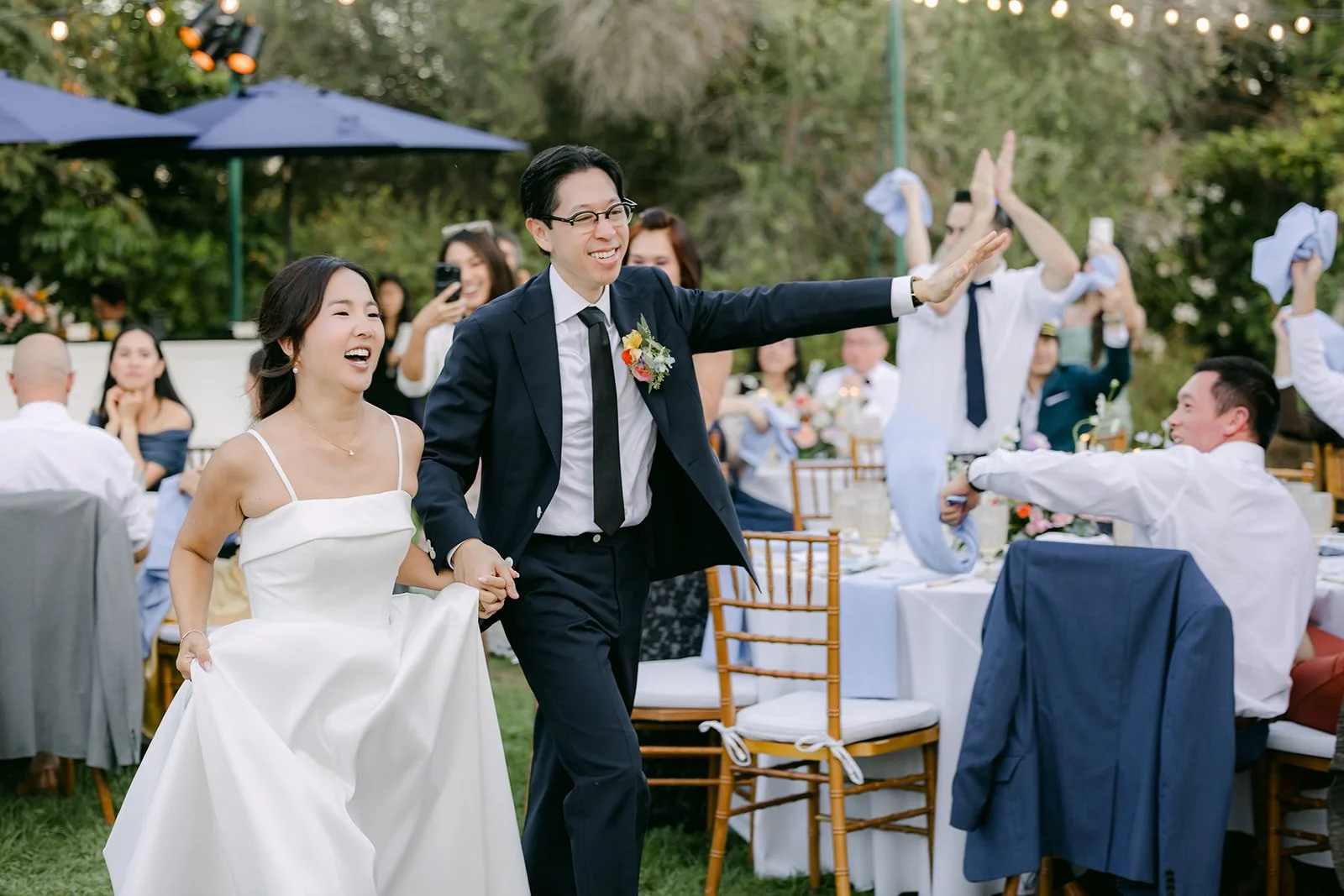 High-fives down the aisle of tables during the grand entrance