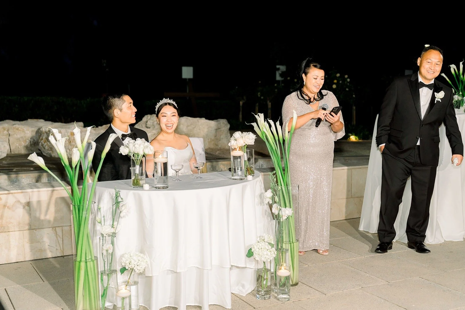 Steven and Jacinda at the sweetheart table during speeches