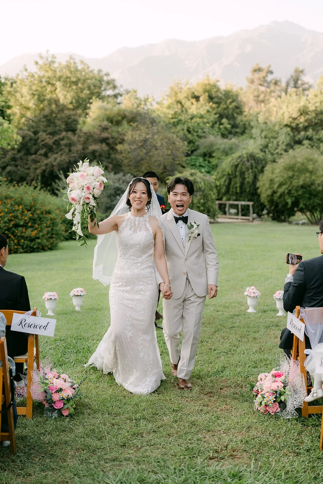 Elaine and Wen walking back up the aisle.