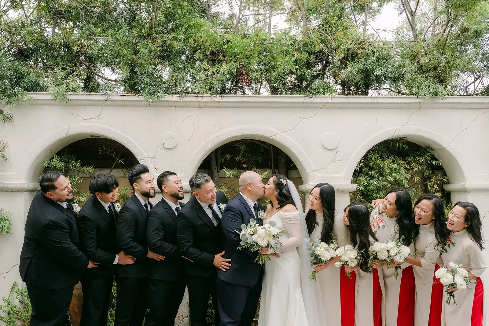 Wedding party lined up in the courtyard