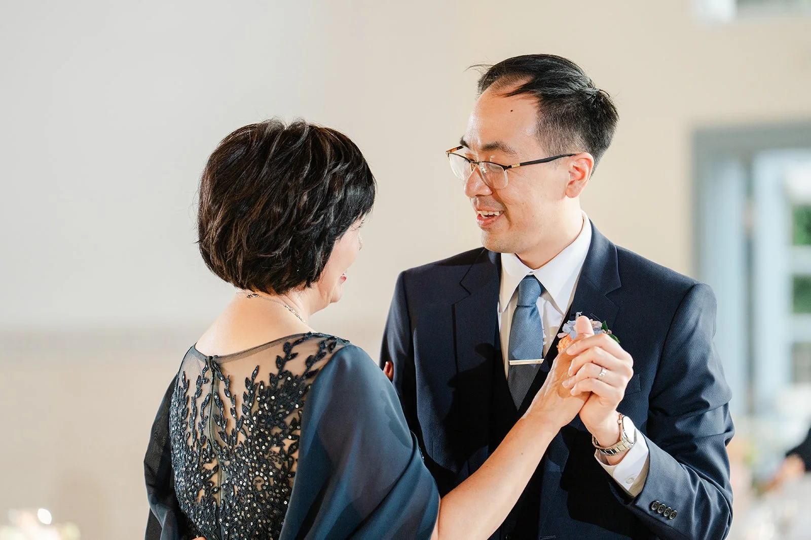 Lawrence smiling with his mom during their dance