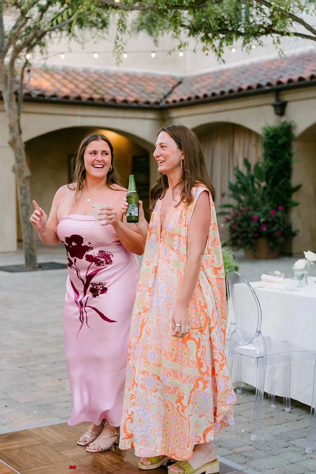 Two guests posing on the dance floor