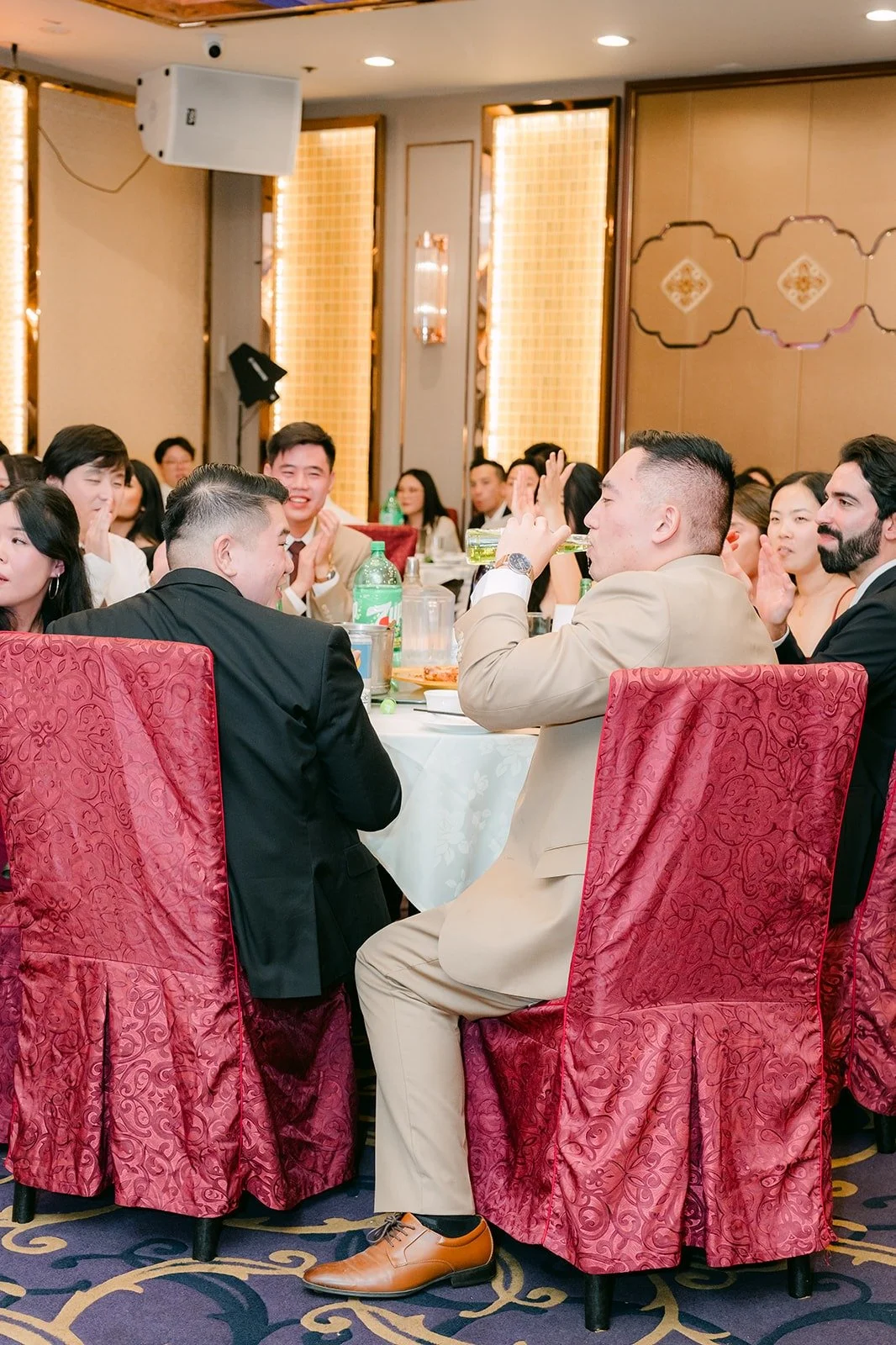 A groomsman gives a speech to the room