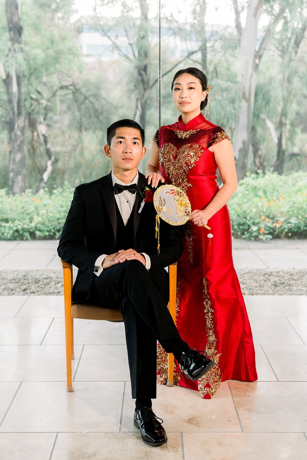 Steven seated with Jacinda beside him in her red dress