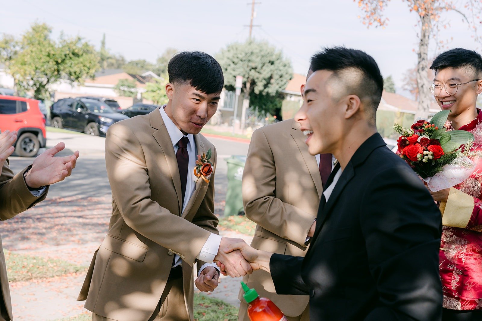 Robert and his groomsmen work through the door game challenges in the driveway