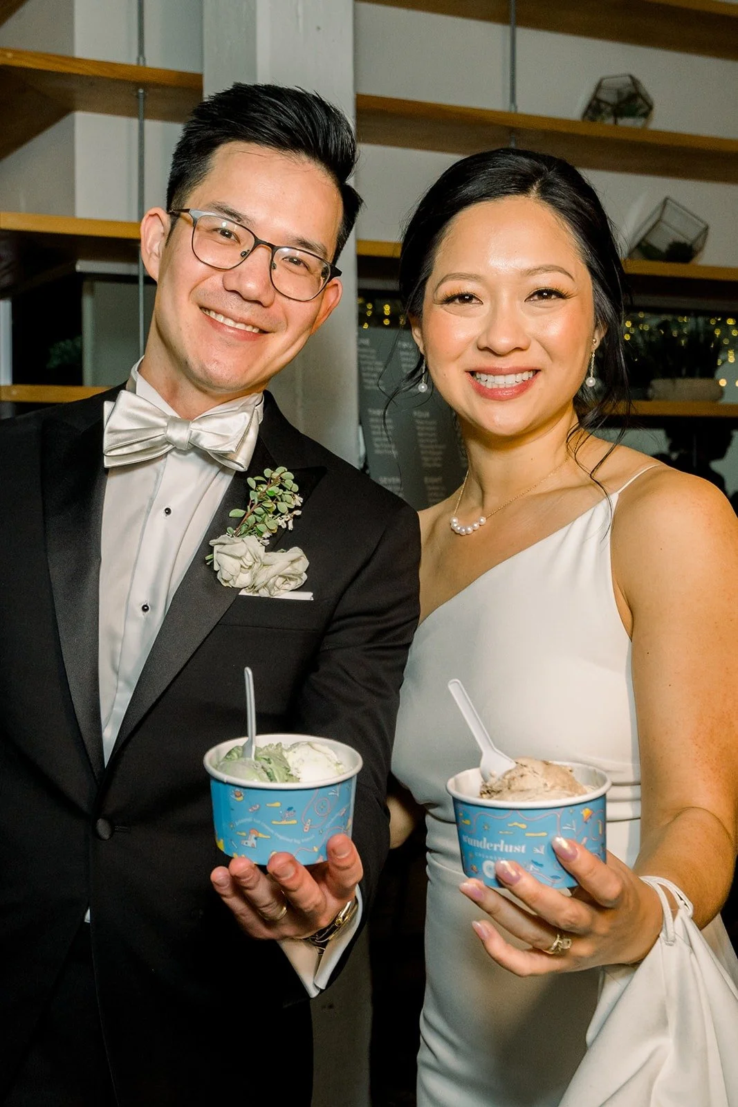 Cindy and Alex hold up their ice cream cups, photographed by One and Only Production