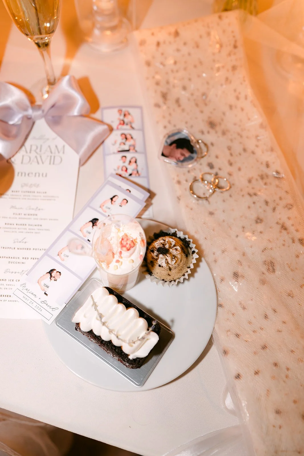 Photo booth strips and desserts on the reception table