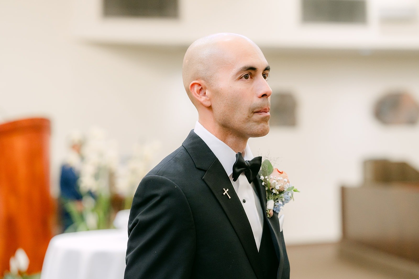 Daniel waits at the altar as the ceremony begins