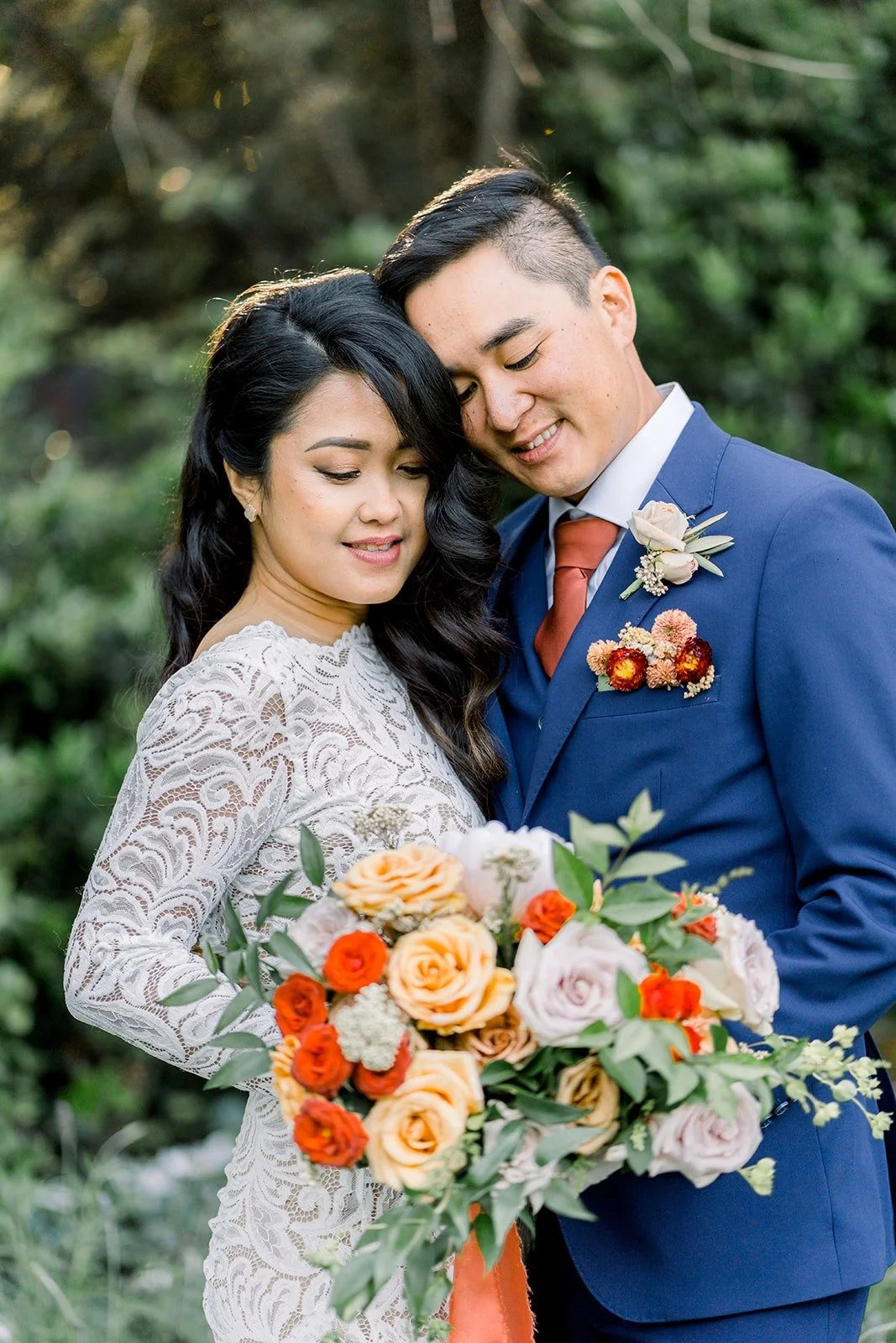 Close portrait of Hannah and Vincent with her bouquet