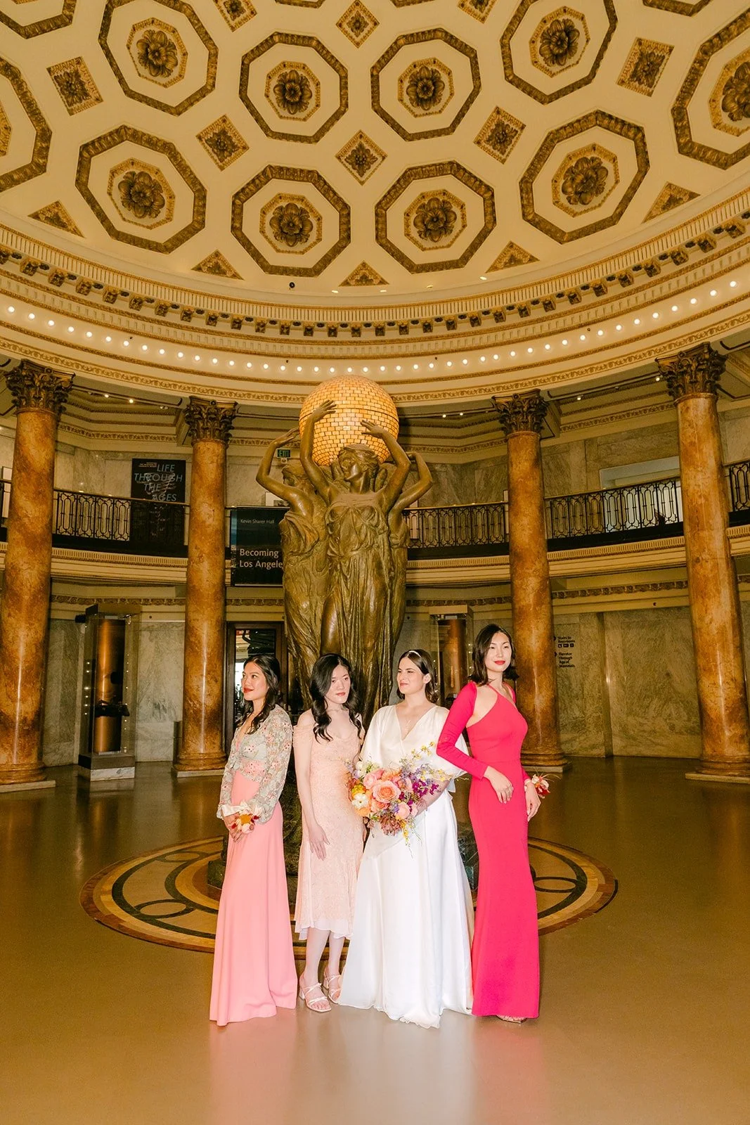 Jessie and her bridesmaids in the Rotunda at the Natural History Museum