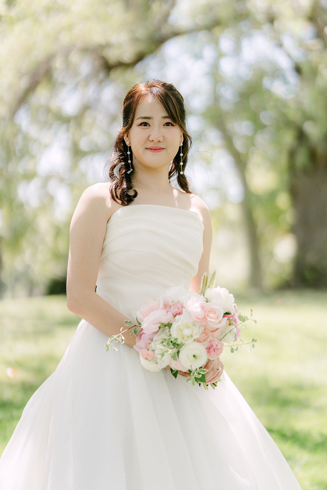 Judy smiling with her pink bouquet