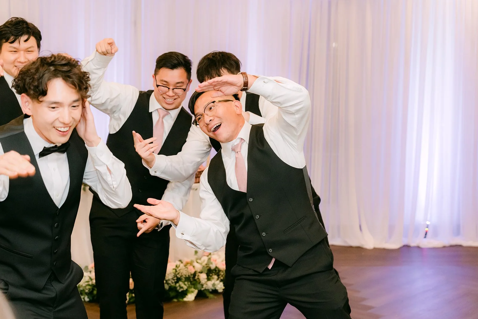 Groomsmen performing their surprise dance