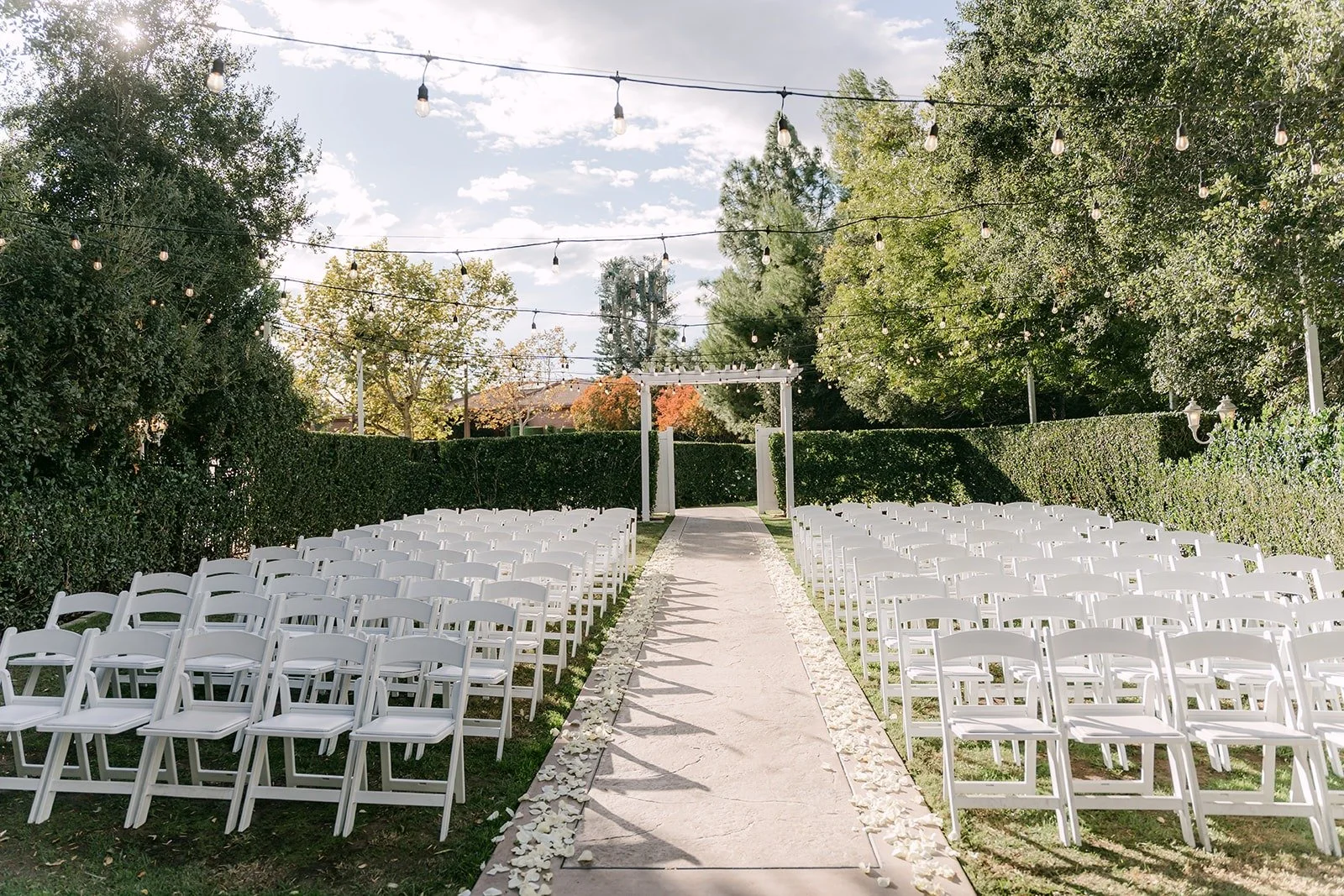 Rows of white chairs lining the aisle at Sierra La Verne