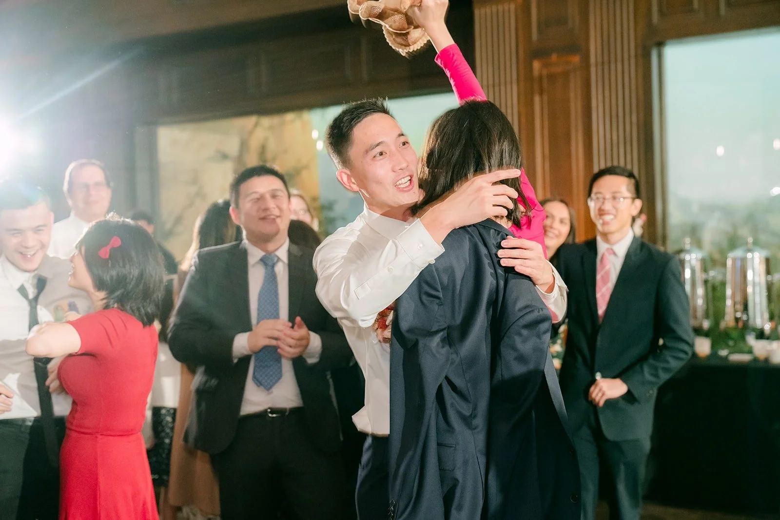 Guests celebrating the catch, photographed by One and Only Production