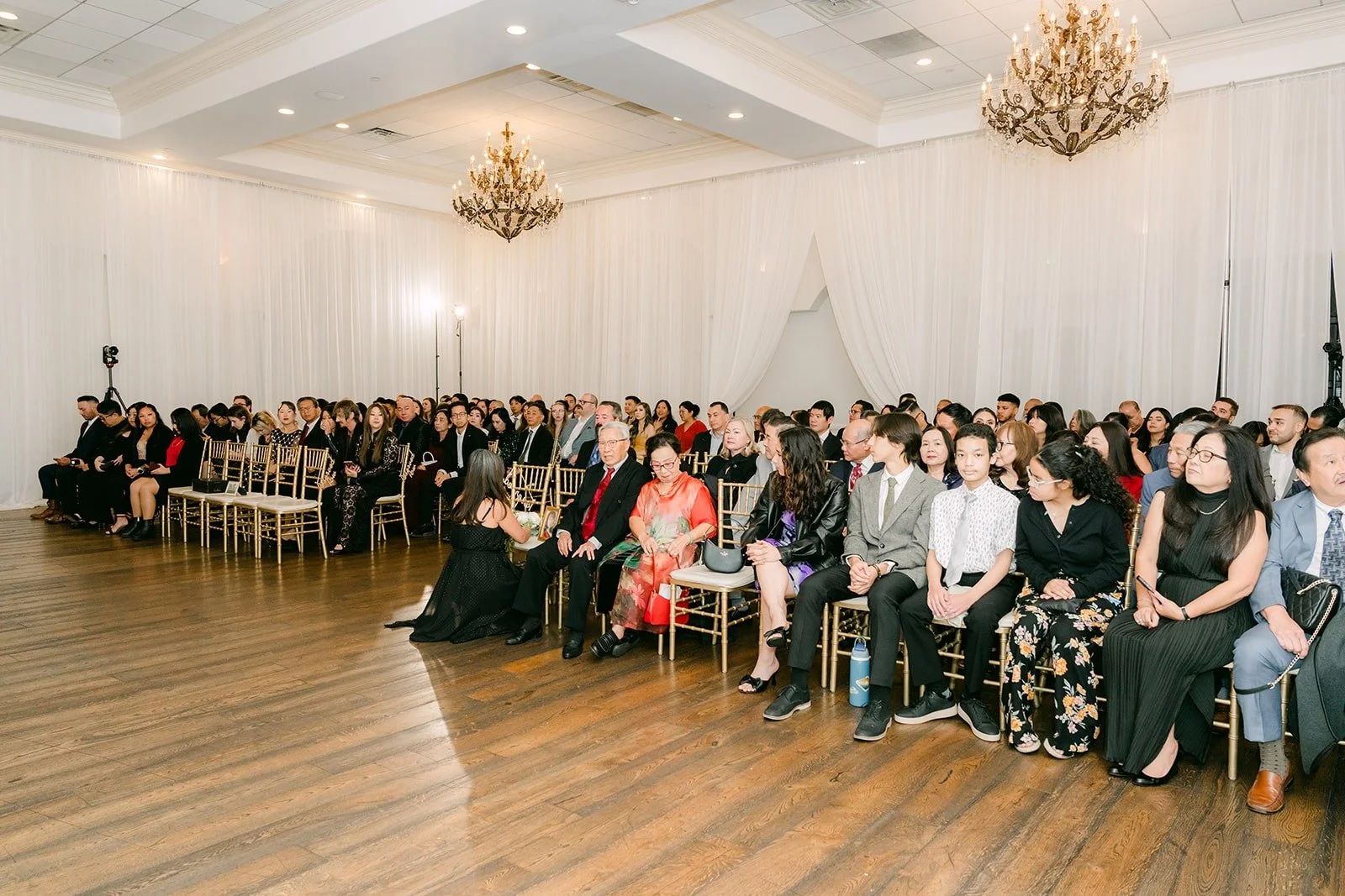 Guests seated for the ceremony in the ballroom at The Villa
