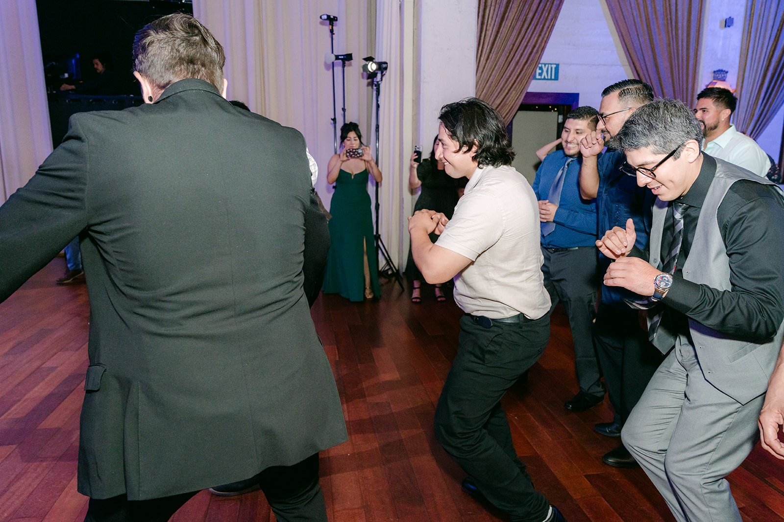 Guests dancing in a circle during a reception game