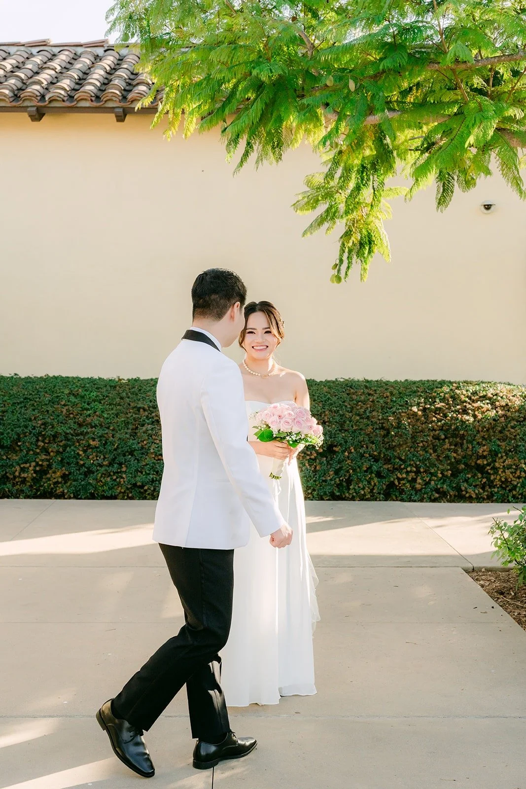 Chungman walking Ivy through the courtyard after their first look