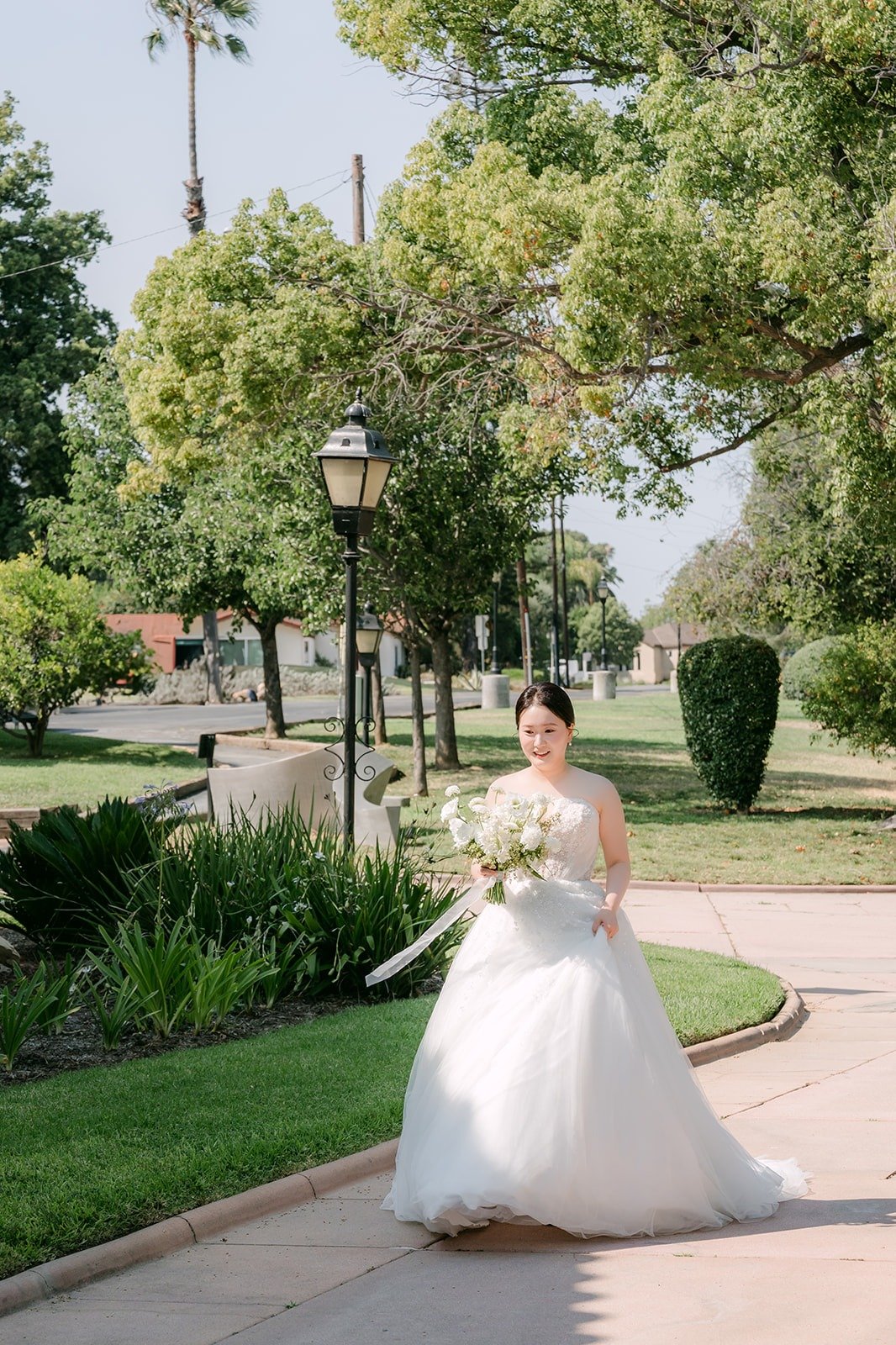 Amy walking up the garden path for the first look