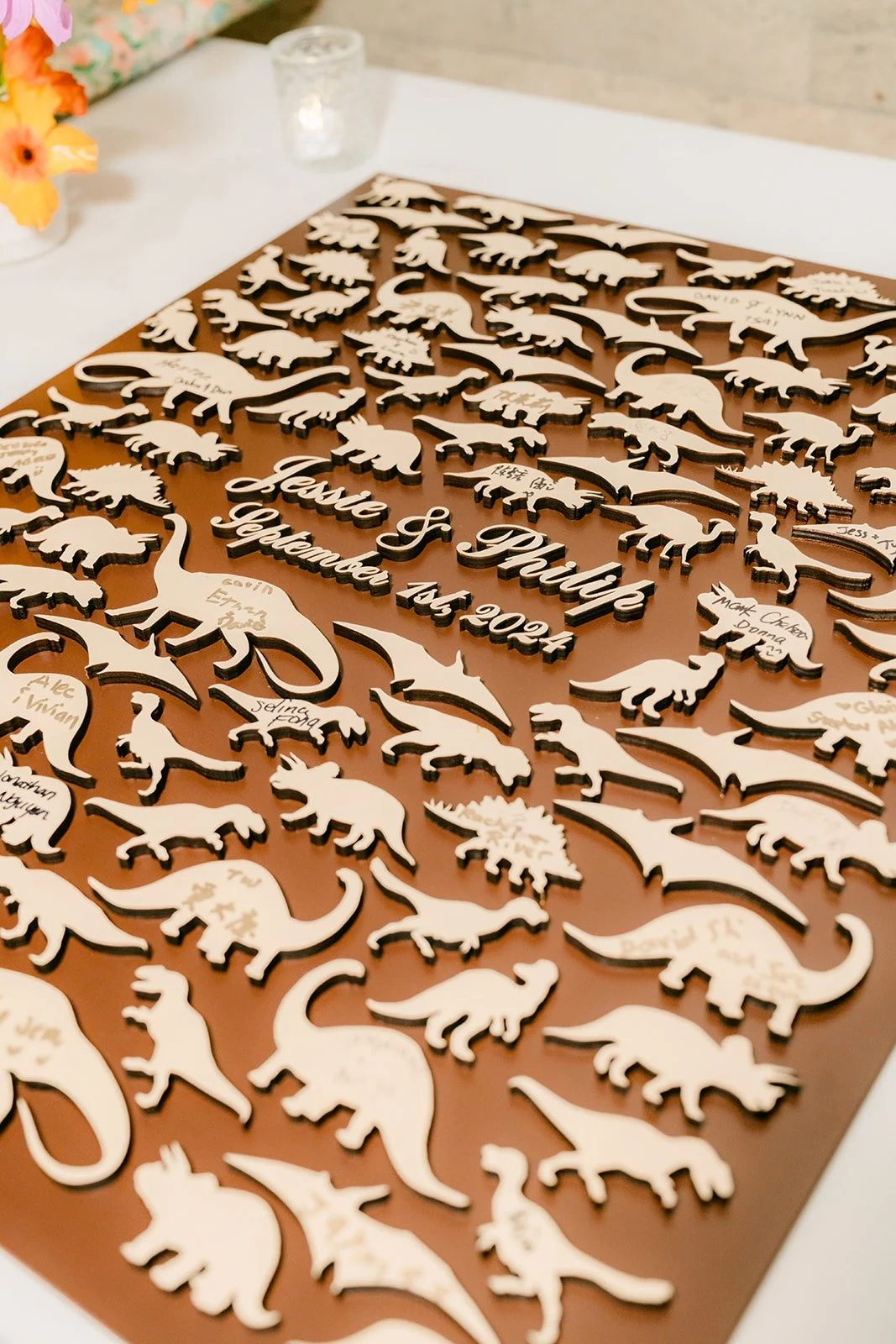 A guest book made of wooden dinosaur cutouts
