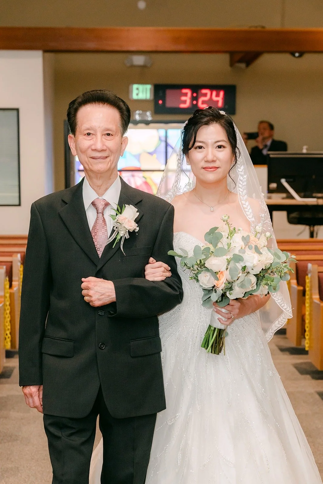 Eunice walks down the aisle with her father