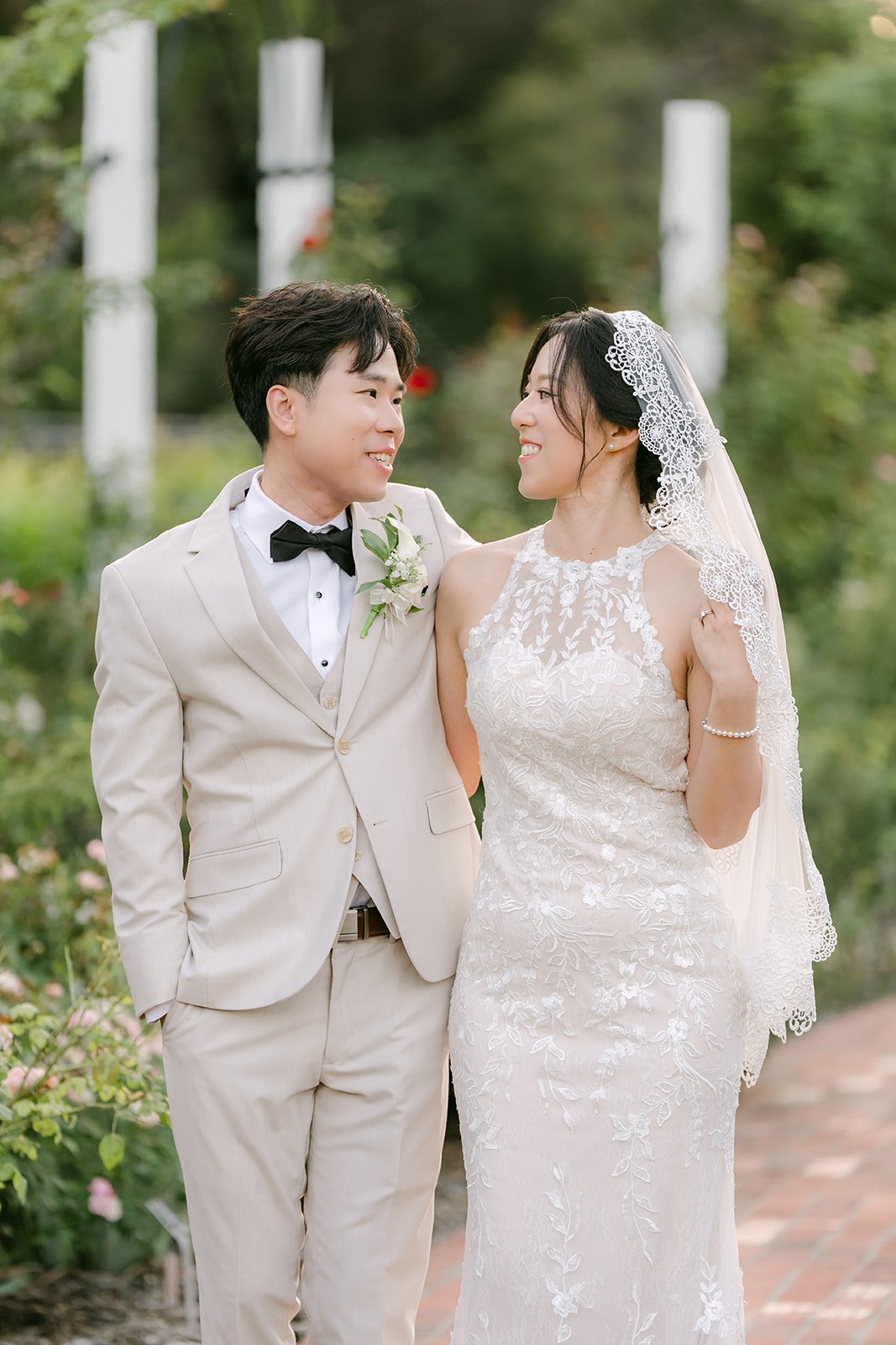 Elaine and Wen close together at the pergola, photographed by One and Only Production.