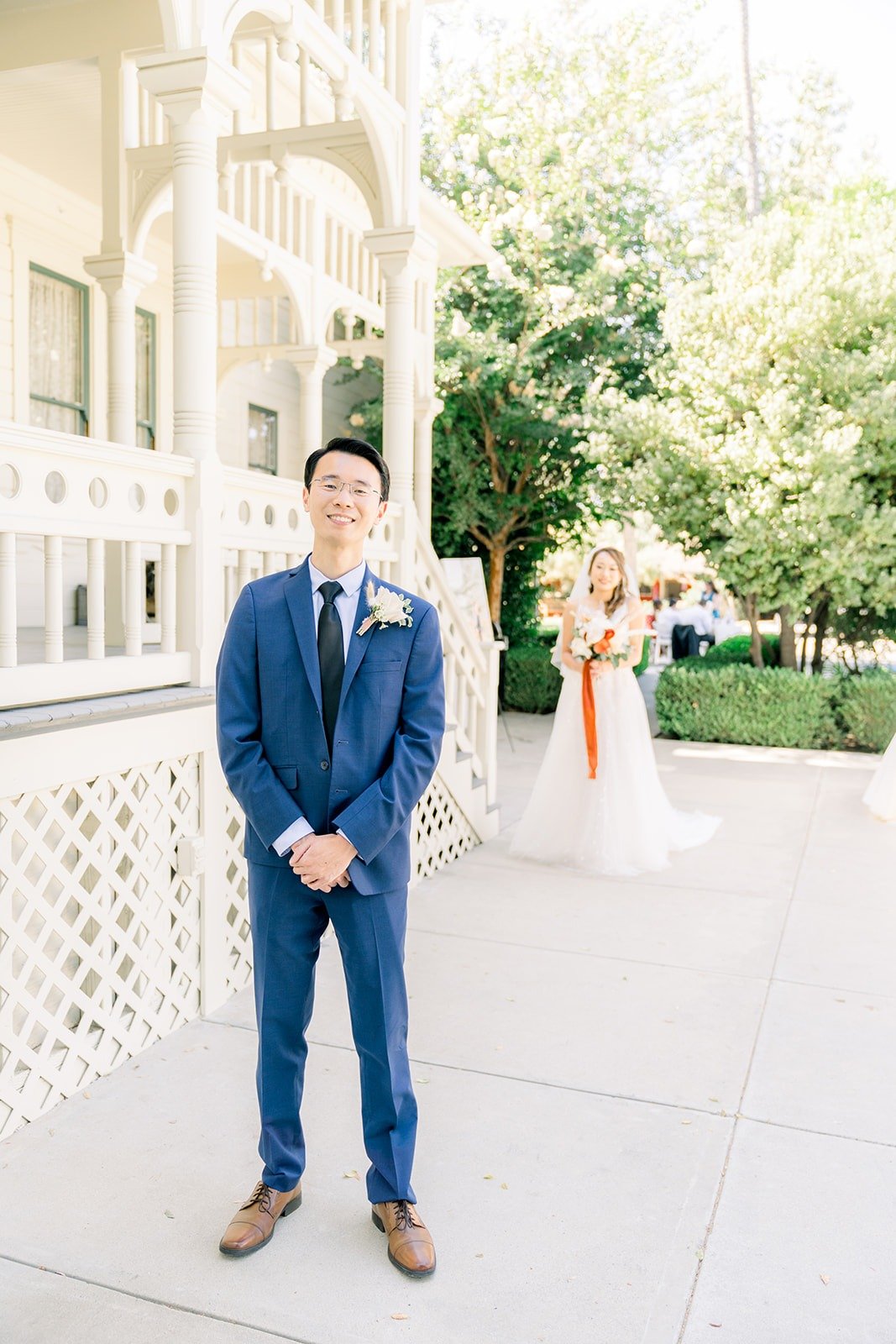 Alex waiting as Ariel walks up behind him